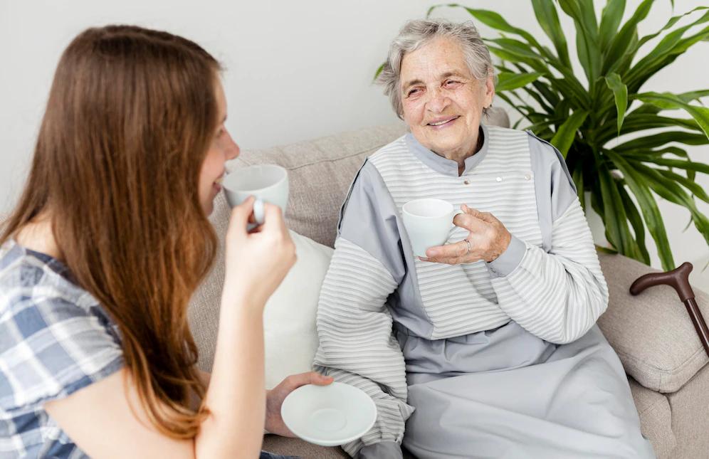 Elderly woman and young woman together and Caring for a Loved One with Dementia: Tips and Strategies